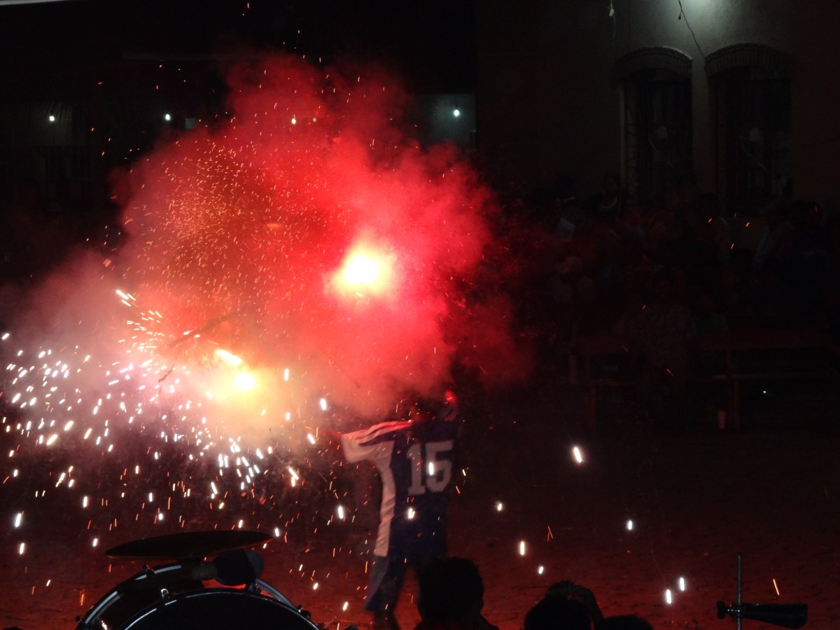 man with fireworks bull